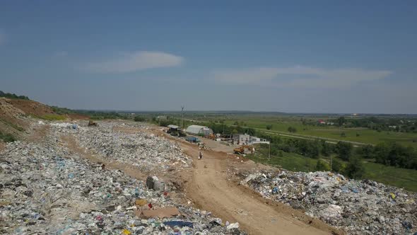 Aerial View of City Garbage Dump. Gulls Feeding on Food Waste. alt