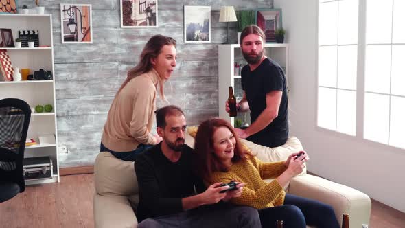 Professional Female Gamer Winning Against Her Friend alt