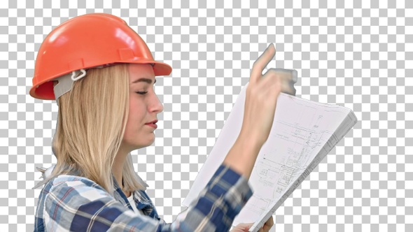 Female construction engineer reading plans, Alpha Channel