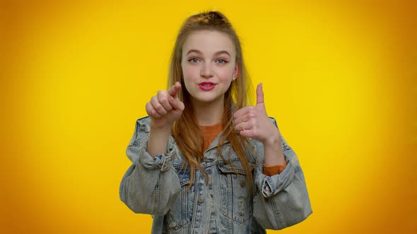 Pretty Adult Girl Pointing to Camera and Looking with Playful Happy Expression Making Choice alt
