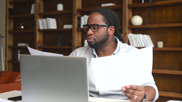 Young African American Employee Doing Paperwork alt