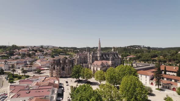 Majestic monastery with tower and cityscape of Batalha in Portugal, aerial view alt