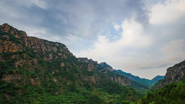 The mountains and valleys are cloudy alt