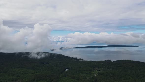 Thick cloud hovering over the Powell River along the stunning Sunshine Coast Trail in British Columb alt