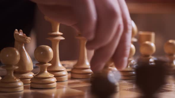 Close Up Rack Focus Pawn Move on Wooden Chessboard alt