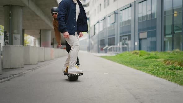 Close Up Leg Shot of a Skaters with Electric Skateboard alt