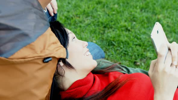 Couple using mobile phone while interacting with each other 4k alt