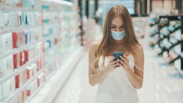 Beautiful Caucasian Woman in Protective Mask Looks at Rating  alt