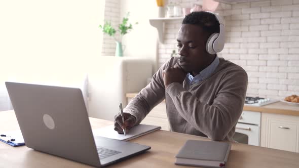 Black Male Student Talking Video Conference Calling at Home Office alt