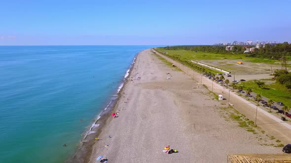 Aerial view on beach and umbrellas. Beach and blue water. alt