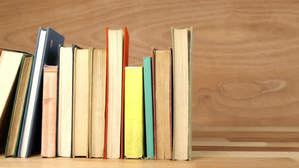 Various books arranged on a table alt