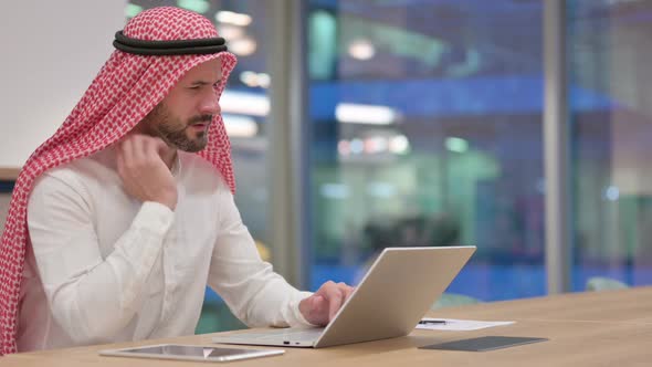 Tired Arab Businessman with Laptop Having Neck Pain alt