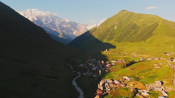 Long Birds Eye Panoramic View Of Ushguli Village With Mountains  alt