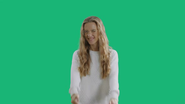 Smiling Woman Is Showing Thumbs Up Isolated on a Green Screen Chroma Key Background alt