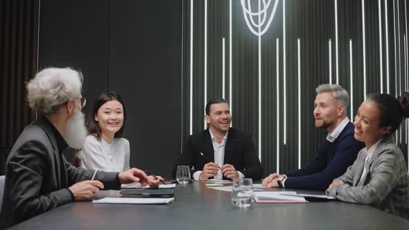 Business Team Happy Talking at the Meeting Laughing and Smiling alt