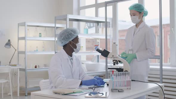 Two Diverse Scientists in Lab alt