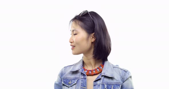 Beautiful Young Asian Chinese Adult Woman Happy Smiling Looking Left and Right Sidewearing Casual alt