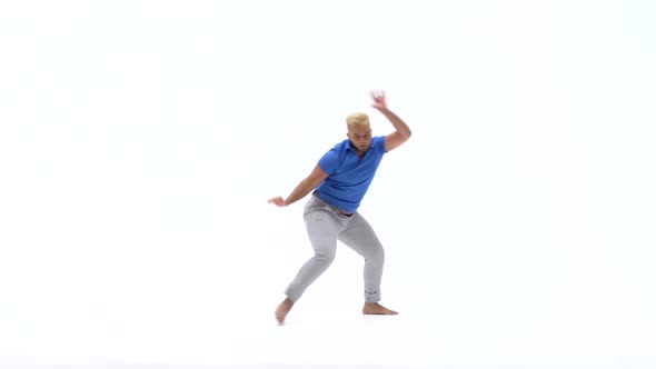 Man Practicing Capoeira in White Background of Studio. Afro-Brazilian Martial Art That Combine alt