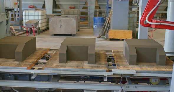 Concrete Products are on the Conveyor in the Warehouse alt