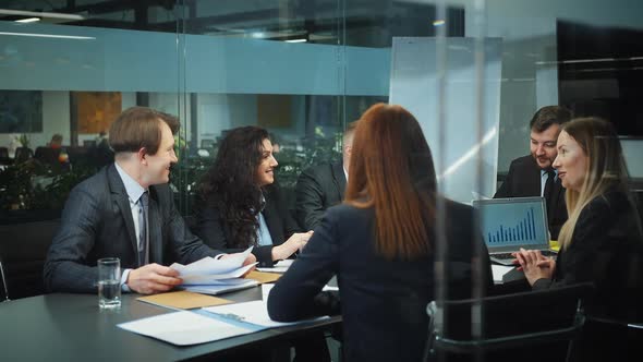 Top Managers Discussing Project at Business Meeting alt