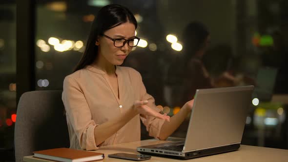 Support Officer Outraged by Bad Client Feedback but Responding Politely, Smiling alt