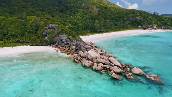 Drone Aerial Flight Around Granite Rocks Range Between Grand and Petite Anse with Azure Crystal