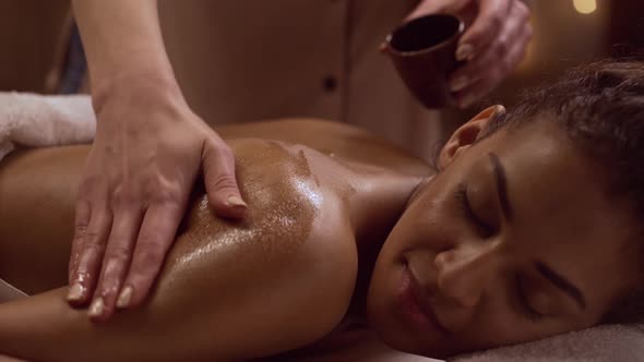 Close Up Footage of Serene African American Female Lying in Day Spa alt