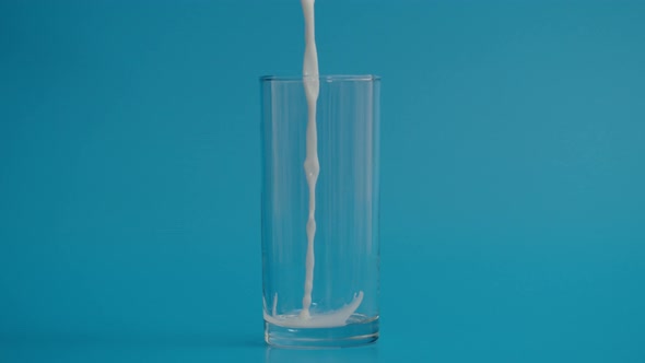 Super Slow Motion of Milk Drops Falling in Transparent Glass alt