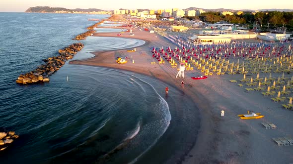 Colorful Beach Chairs and Amenities in Rimini Beach in Italy