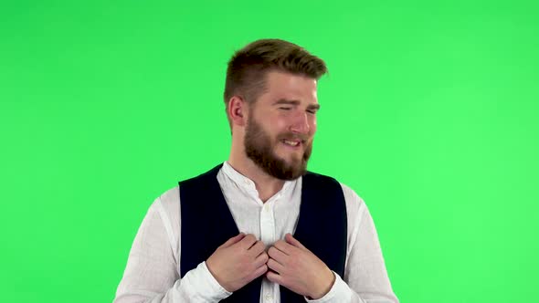 Man with Smile Expressing He Is Innocent, Saying He Doesn't Know What's Going. Green Screen alt