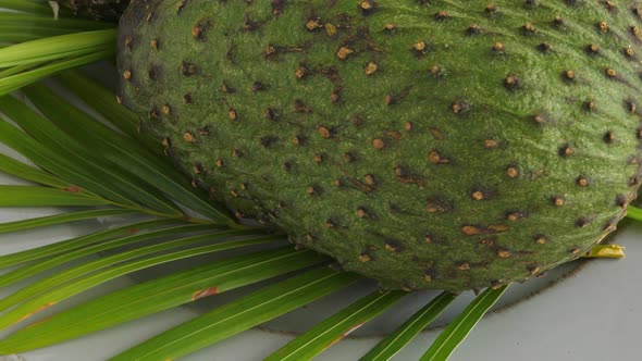 Closeup of Green Soursop Graviola, Exotic, Tropical Fruit Guanabana on Plate alt
