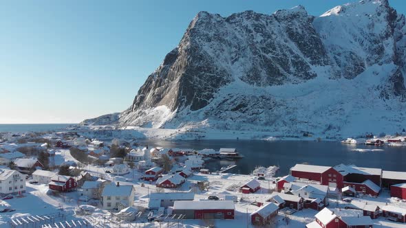 City of Reine under the fresh snow in a blue and sunny sky during winter. 