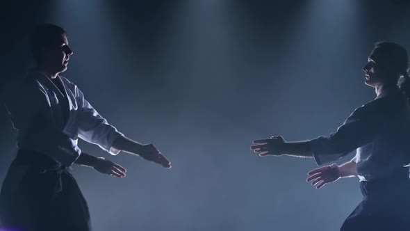 Fight Between Two Aikido Fighters in the Dojo. Slow Motion. Close Up. alt