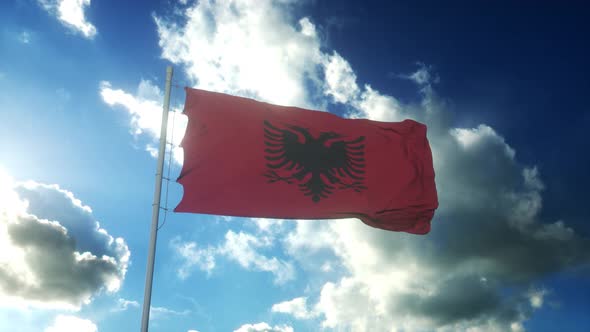 Flag of Albania Waving at Wind Against Beautiful Blue Sky alt