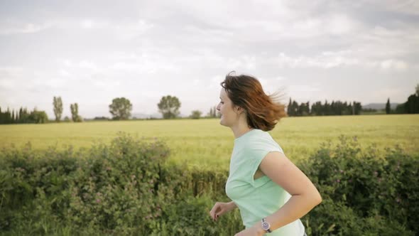 Young Caucasian Girl Woman Enjoying Life And Running Jogging In Spanish Countryside Road Through alt