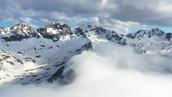 Snow Capped And Foggy Mountains alt