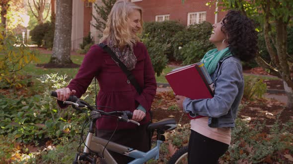 Two college students on campus talking