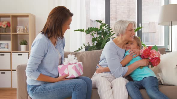 Granddaughter Giving Flowers To Grandmother Stock Footage Videohive