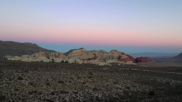 Drone Flying Towards A Natural Rock Formations In The Wilderness With Colorful Sky In Utah, USA. - D alt