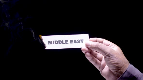 Hand Holds Paper Burning Middle East alt