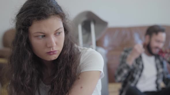 Close Up Portrait of Sad Angry Woman and Happy Man in Summer Hat on the Background alt