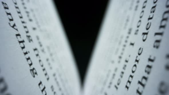 Closeup Book Sheets with English Text. Camera Moving Between Book Pages alt