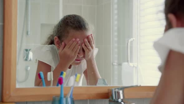 Portrait Happy Cute Young Teenage Girl Washes His Face in Bathroom and Smiling alt