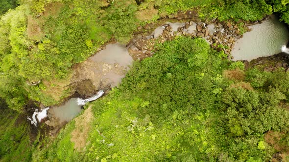 Haena State Park. Picturesque Thin Waterfall Among the Tropical Green. Hawaii alt