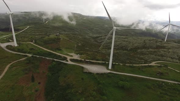 Wind Turbines at Morning Fog alt