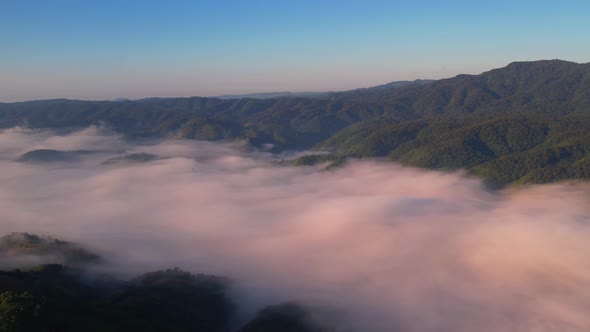 4K Drone Flying in the clouds. Flying through the clouds during sunrise alt