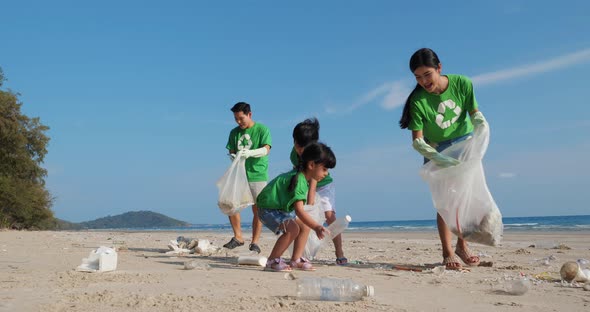 Family volunteer cleaning beach, Stock Footage | VideoHive