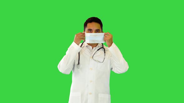 Hispanic Doctor in White Coat Walk Put on Protective Medical Surgical Mask to Protect From Covid19