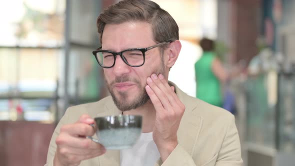 Man Having Toothache After Drinking Coffee alt
