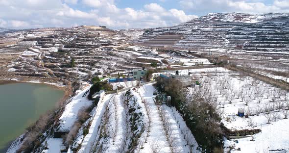 Aerial view of a dry vineyard in the snow, Golan Heights, Israel. alt